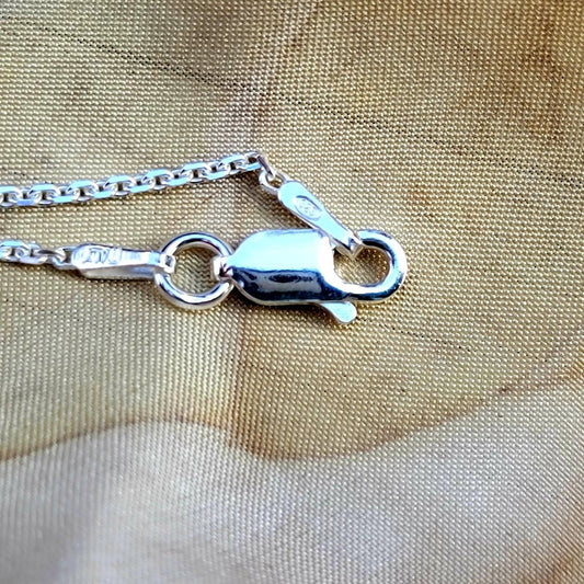 925 Sterling beveled chain with lobster Claw clasp laying on fabric