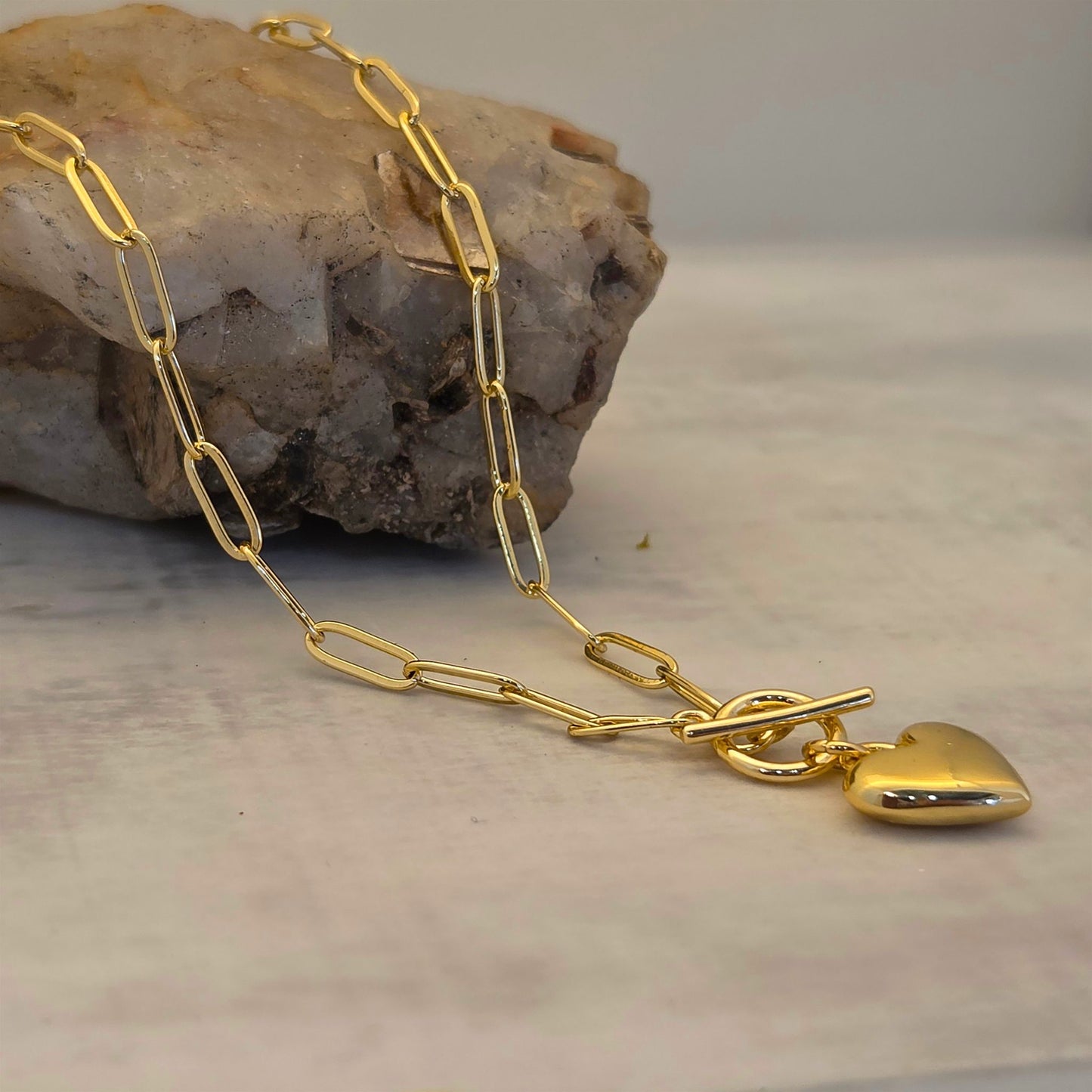 Gold heart charm necklace with paperclip chain and toggle clasp by Boomdyada