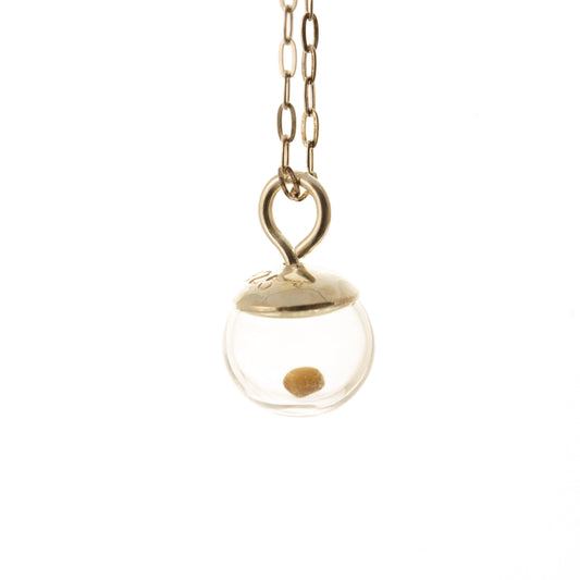 Tiny 925 sterling silver charm with one tiny real mustard seed  inside a clear 8mm hand blown glass globe.  Mustard seed moves freely inside the globe. Charm is strung onto either a 16, 18 or 20 inch flat sterling cable chain with spring ring clasp.