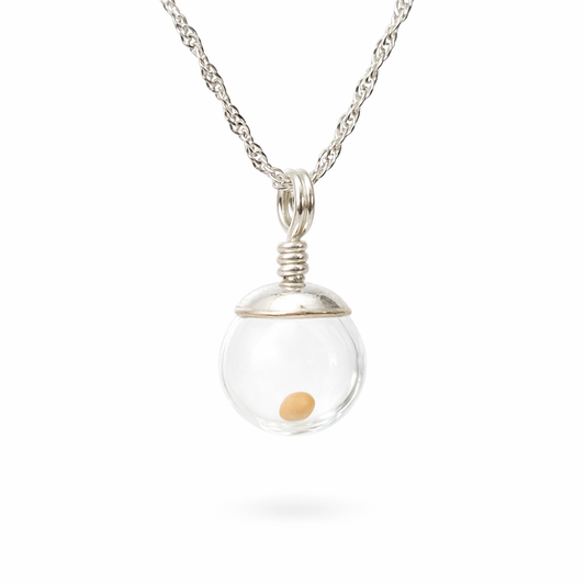 Sterling silver mustard seed necklace with twisted Singapore chain and clear glass globe pendant holding a real mustard seed.
