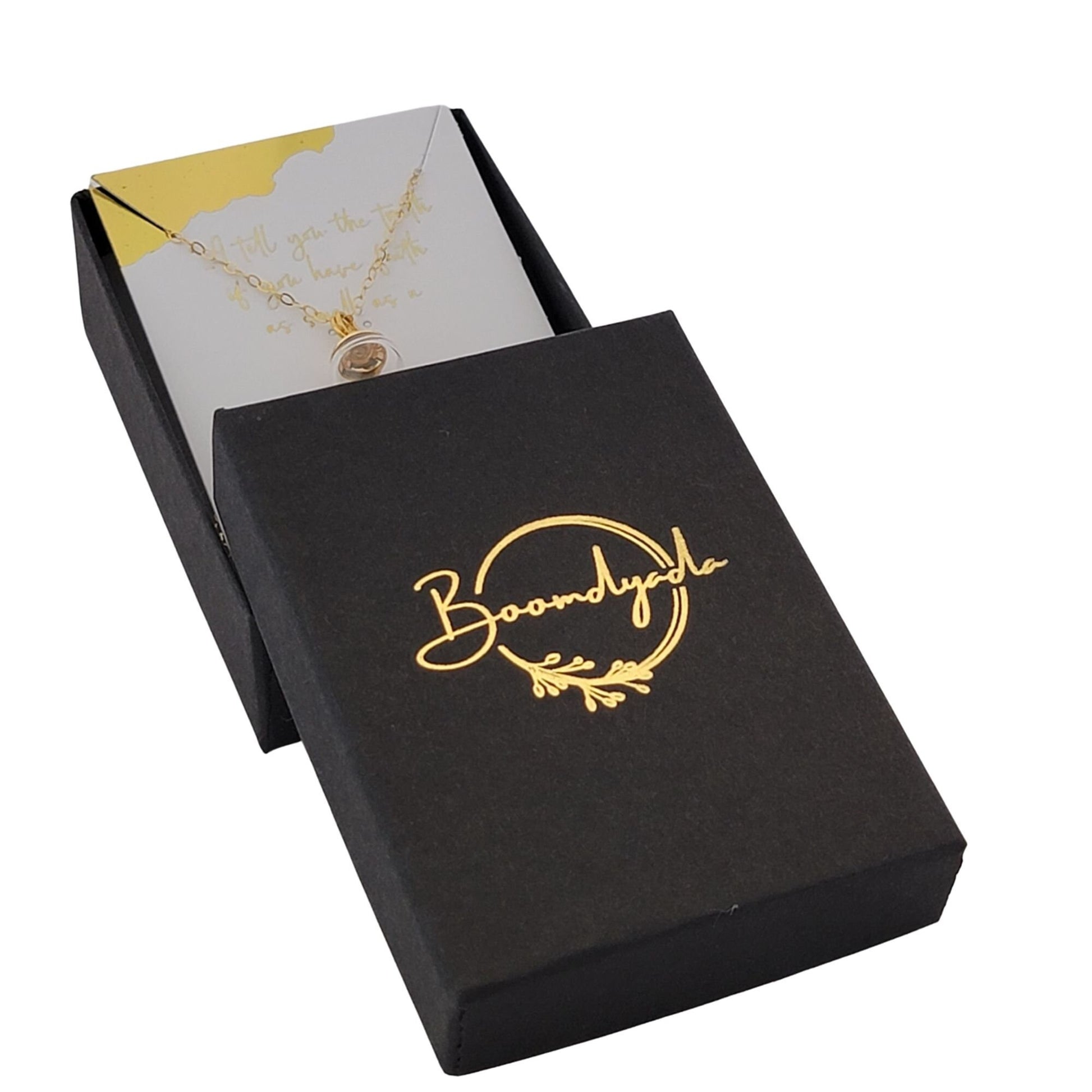 Your necklace will arrive in a black matte jewelry box with a gold foil-stamped Boomdyada logo centered on the outside of the lid. This elegant box is perfect for gift-giving! All orders ship the next business day.